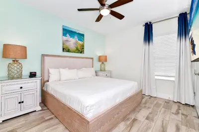 a bedroom with a bed and a ceiling fan at Cozy Villa Near Disney With Margaritaville Resort And Island H20 Waterpark Access - 2907Cl in Orlando