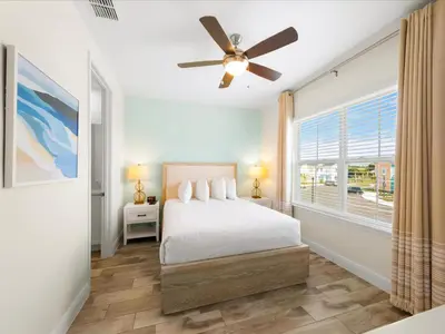 a bedroom with a bed and a ceiling fan at Bright Villa Near Disney With Margaritaville Resort & Island H20 Access - 8159Cp in Orlando