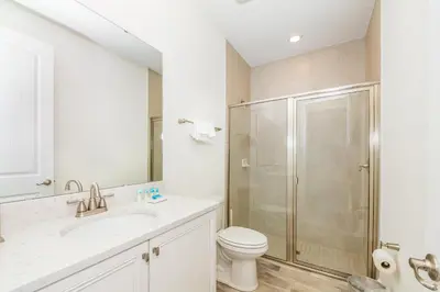 a bathroom with a shower and a toilet and a sink at Comfy And Delightful Villa Near Disney With Margaritaville Resort & Island H20 Access - 8185Su in Orlando