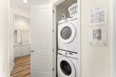a laundry room with a washer and dryer at Relaxing Paradise Villa Near Disney With Margaritaville Resort & Island H20 Waterpark Access - 2951Cl in Orlando
