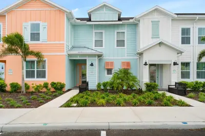a house with colorful houses at Relaxing Paradise Villa Near Disney With Margaritaville Resort & Island H20 Waterpark Access - 2951Cl in Orlando
