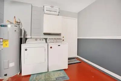 a kitchen with a stove and a refrigerator at Relaxing Retreat in the Windsor Palms Resort in Kissimmee