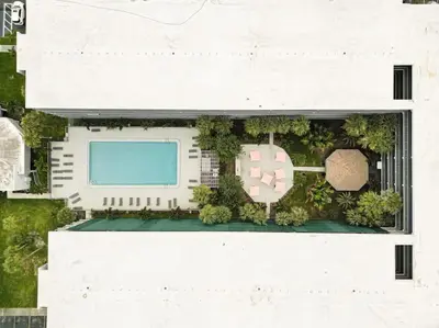 an overhead view of a building with a pool at Orlando Prime Location 1BR Home 5 minutes to Disney in Kissimmee