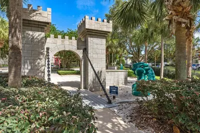 a fake castle in a park with a gate at 3BR Disney Getaway, Pool, Waterslides, By Disney in Orlando