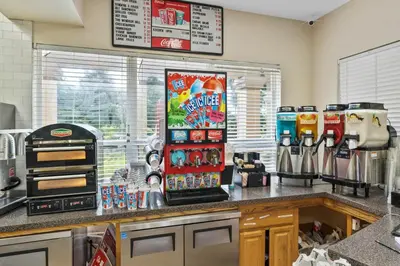 a kitchen with a counter top with a coffee shop at 3BR Disney Getaway, Pool, Waterslides, By Disney in Orlando