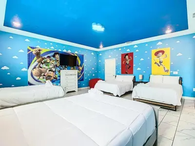 a bedroom with two beds and a blue ceiling at Once Upon a Villa in Kissimmee