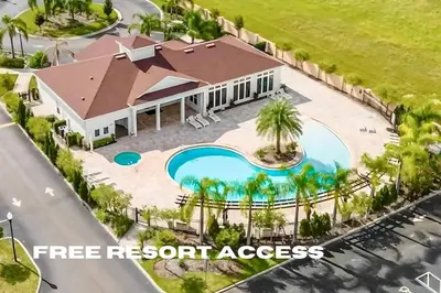 an aerial view of a home with a pool and palm trees at Spacious 4-Bedroom Family Retreat Near Disneyland! in Kissimmee