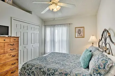 a bedroom with a bed and a ceiling fan at 4 Bedroom Villa - Indian Creek in Kissimmee