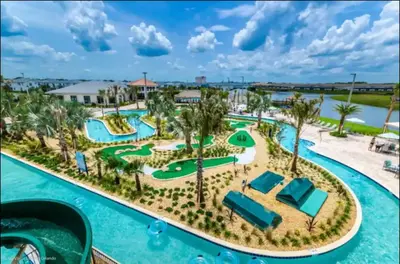 an aerial view of a resort with a pool at Bright and Modern 4BR Home,Pool,Slides,By Disney in Kissimmee