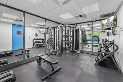 a gym with several treadmills and machines at Apartment in Florida near Universal and Intern. Dr in Orlando