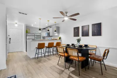 a dining room and kitchen with a table and chairs at Fantasy Villas resort - Waterpark Included - Family Paradise! minutes to Disney in Kissimmee