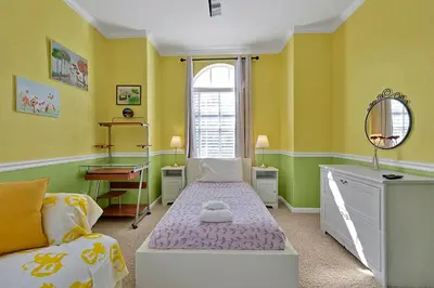 a small room with a bed and a window at Entire home w/ Private Pool,Gated Near Disney in Orlando
