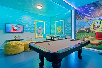 a play room with a pool table in it at New Home 8 Bedrooms At Bella Vida in Kissimmee