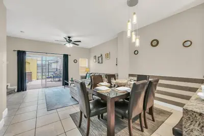 a dining room with a table and chairs at Family Oasis Cozy Retreat with Bunk Room in Kissimmee