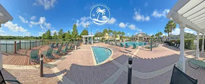 a pool at a resort with lounge chairs at Deluxe Villas Resort at Seven Dwrafs - Close to Disney in Kissimmee