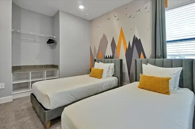 a bedroom with two beds and a mural on the wall at Gorgeous Paradiso Mansion-Poolgame Roomtheater-3 in Orlando