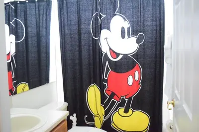 a bathroom with a mickey mouse shower curtain at 2551 Oneida Grantham! in Kissimmee