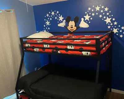 a bedroom with a bunk bed with stars on the wall at 8056 Indian Creek Blvd in Kissimmee