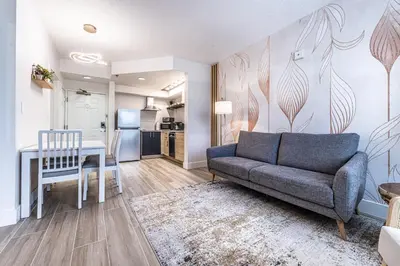 a living room with a couch and a table at Apartment - near Epic Universe and Universal, free parking in Orlando