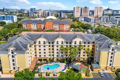 an aerial view of a large building with a swimming pool at One bedroom unit near Epic Universe and Universal, free parking in Orlando