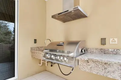 a kitchen with a grill on a counter at Luxury 4BR Townhouse Next to Disney Orlando 3175 in Orlando