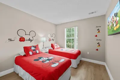 a bedroom with two beds and a window at 8496 Resort 3BR Condo by Disney World Orlando in Kissimmee