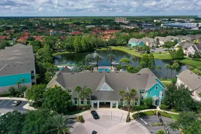 an aerial view of a house with a lake at Runaway Beach Club Resort Condo Apt Disney 6102 in Kissimmee