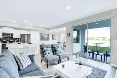 a living room with a couch and a table at Modern Storey Lake Resort Disney Orlando 3171-107 in Kissimmee