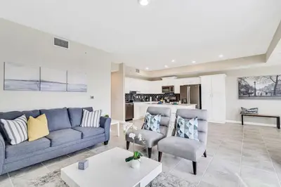 a living room with a couch and two chairs at Modern Storey Lake Resort Disney Orlando 3171-107 in Kissimmee