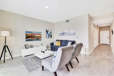 a living room with a couch and a table at Modern Storey Lake Resort Disney Orlando 3171-107 in Kissimmee