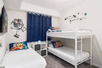 a bedroom with two bunk beds and a captain america mural at Modern Storey Lake Resort Disney Orlando 3161-107 in Kissimmee
