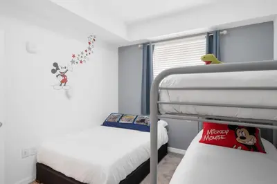 a bedroom with two bunk beds and a window at Modern Storey Lake Resort Disney Orlando 3191-106 in Kissimmee
