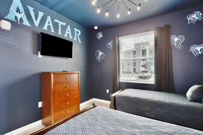 a bedroom with a bed and a dresser and a tv at Modern Storey Lake Resort Disney Orlando 3121-108 in Kissimmee