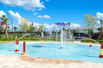 a pool with a water fountain in a park at Modern Storey Lake Resort Disney Orlando 3191-204 in Kissimmee