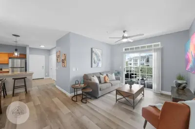 a living room with a couch and a table at Secret Lake Resort 2BR Condo Apt Disney 3176-301 in Kissimmee