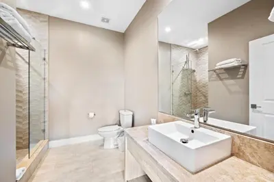 a bathroom with a sink and a toilet at MAGIC VILLAGE - Near Disney - 4BDR in Orlando