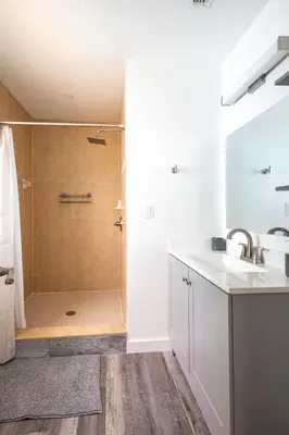 a bathroom with a shower and a sink at The Villa of Somerset in Kissimmee