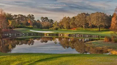 a view of a golf course with a pond at The Villa of Somerset in Kissimmee