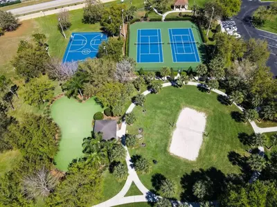 an aerial view of a large estate with a tennis court at Casa Mickey in Orlando