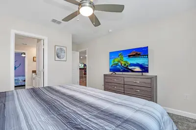 a bedroom with a bed and a ceiling fan at AVH-2746-SL in Kissimmee