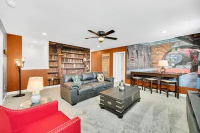 a living room with a couch and a table at Brand New 6BD, Gameroom / Movie Theater And Pool in Kissimmee
