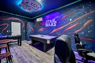 a ping pong room with a star wars mural at Amazing Brand New 5BD, Resort Home/Games Room/Pool in Kissimmee