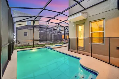 a swimming pool in the backyard of a house at 5BR Family Haven Near Disney with Private Pool in Kissimmee