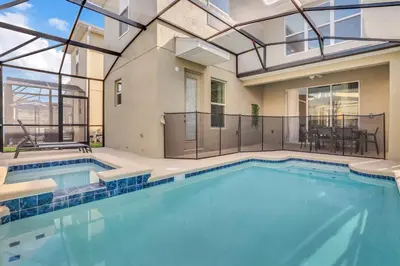 a large swimming pool with a glass ceiling at 5BR Family Haven Near Disney with Private Pool in Kissimmee