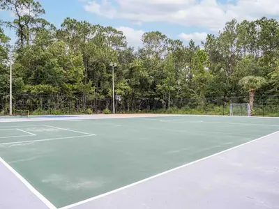 a tennis court with a tennis court at Chilling 1BR Home in Orlando Next to Disney in Vineland