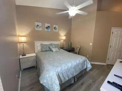 a bedroom with a bed and a ceiling fan at 2029 Morning in Orlando