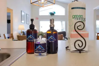 two bottles of alcohol sitting on a kitchen counter at Beautiful Emerald Island Resort Retreat with Private Pool and Spa Close to Disney in Kissimmee