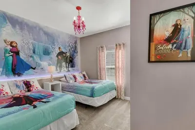 a bedroom with two beds and a movie poster on the wall at 5Q/4B Storey Lake * c/ Piscina * in Kissimmee