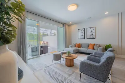 a living room with a couch and a table at TR17145BD - 3 bedrooms home close to Disney in Orlando