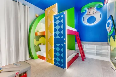 a childs room with a colorful room with a bunk bed at Brand NEW 10Bedrooms At Paradiso Grande in Orlando
